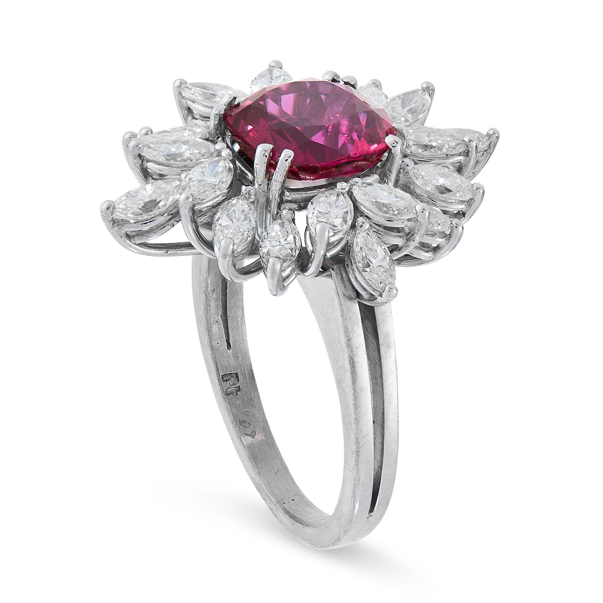 UNHEATED RUBY AND DIAMOND RING in cluster design, set with a cushion cut ruby of 2.93 carats in a - Image 2 of 2