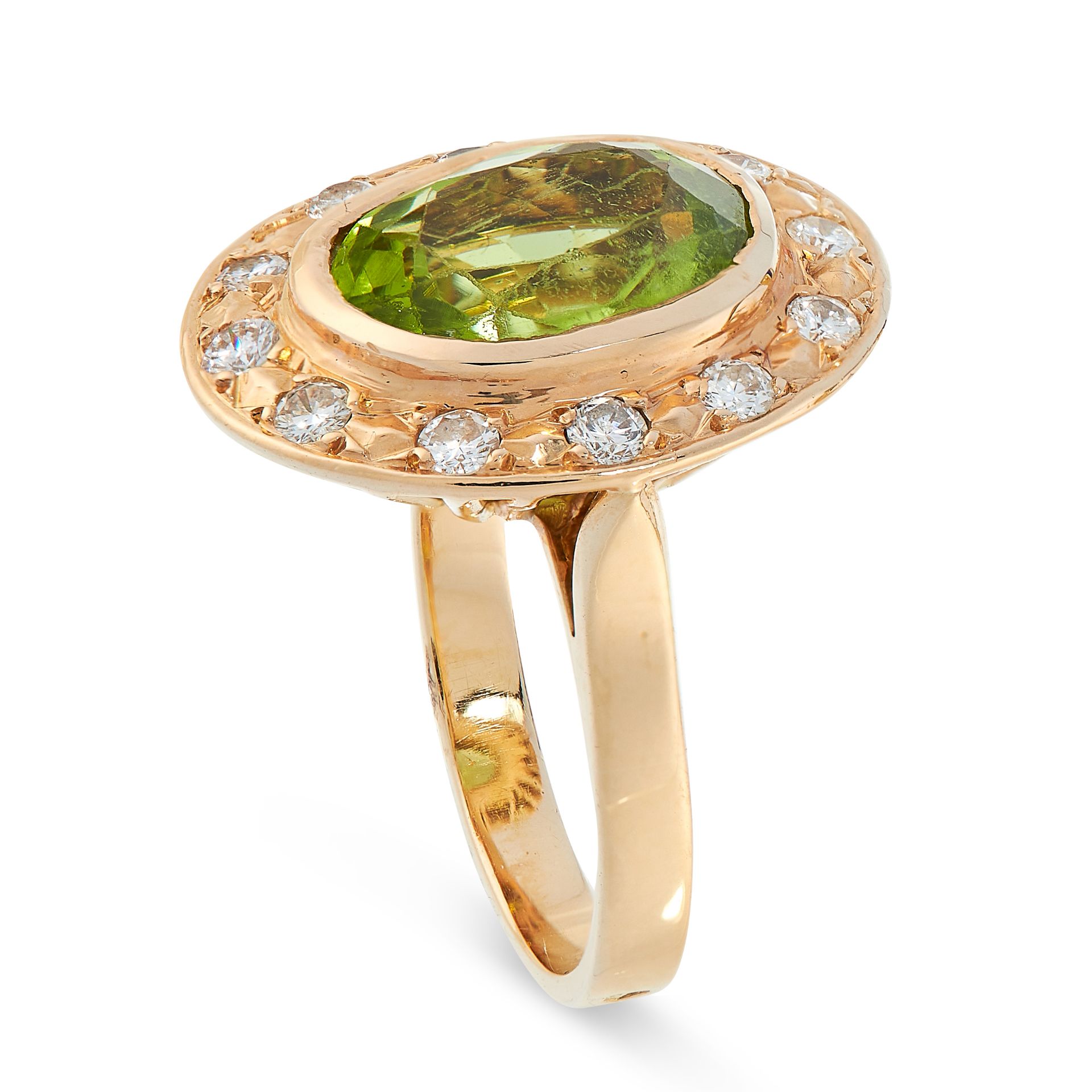 PERIDOT AND DIAMOND RING of cluster design, collet-set with an oval peridot within a border of - Image 2 of 2