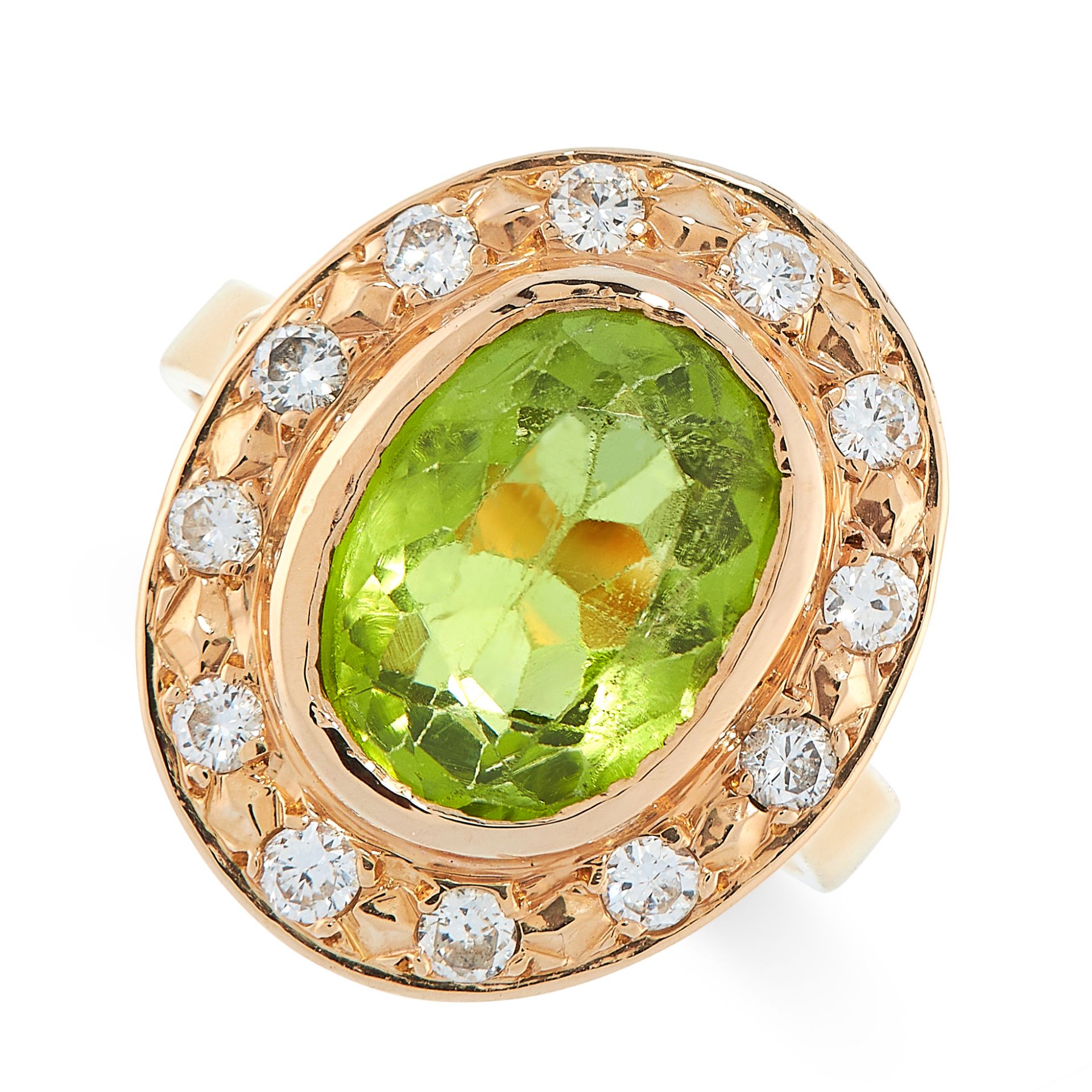 PERIDOT AND DIAMOND RING of cluster design, collet-set with an oval peridot within a border of