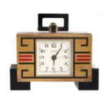 ART DECO MANTLE / DESK CLOCK, CARTIER the rectangular body raised on black hardstone feet, with