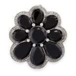 ONYX AND DIAMOND PENDANT / BROOCH, EARLY 20TH CENTURY of scalloped design, set with a cluster of