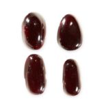 MIXED LOT OF UNMOUNTED GARNET of cabochon cut, totalling 54.09 carats.