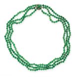 JADEITE JADE AND DIAMOND BEAD NECKLACE comprising three graduated rows of polished jadeite beads
