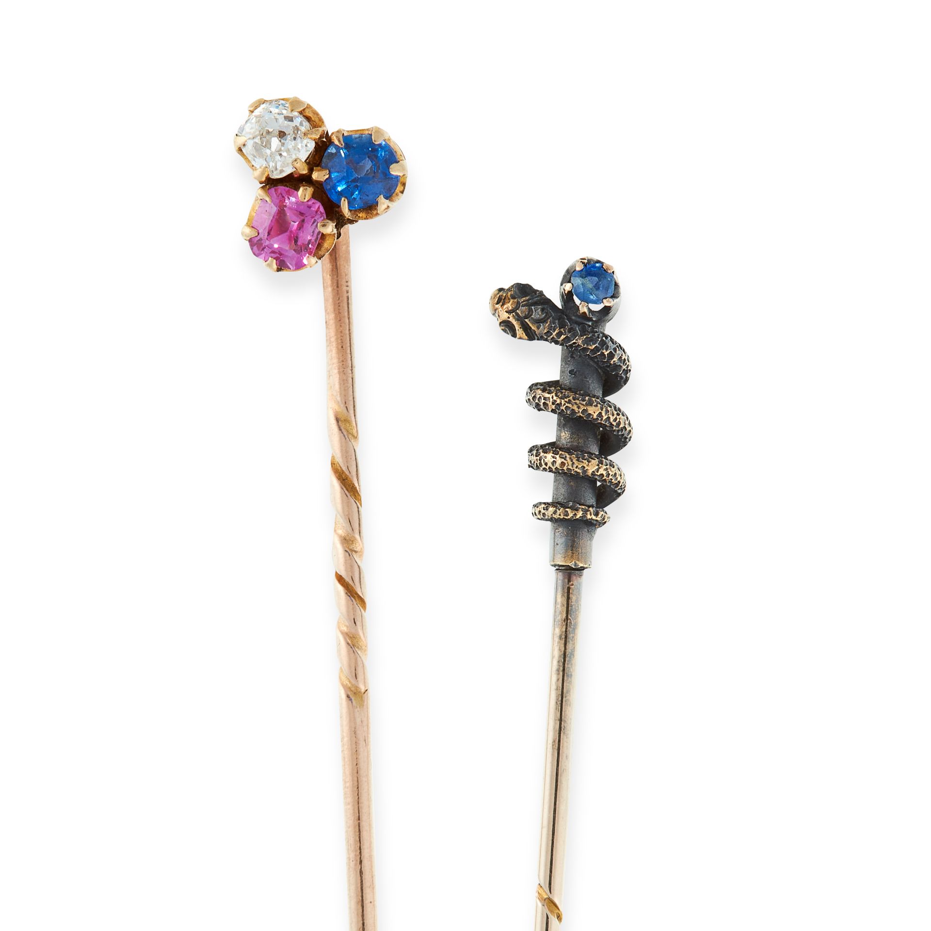 TWO ANTIQUE TIE / STICK PINS in yellow gold and silver, one set with a round cut ruby, diamond and