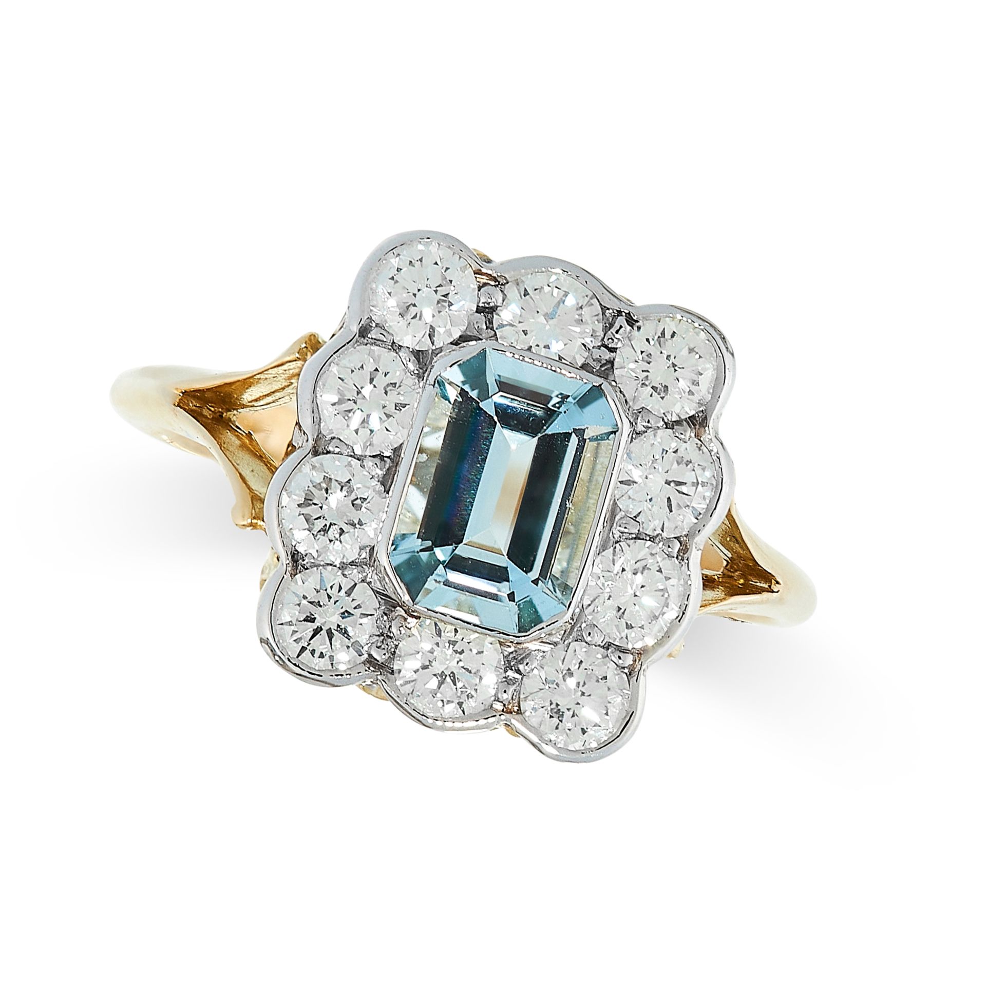 AQUAMARINE AND DIAMOND RING in cluster design, set with an emerald cut aquamarine in a border of