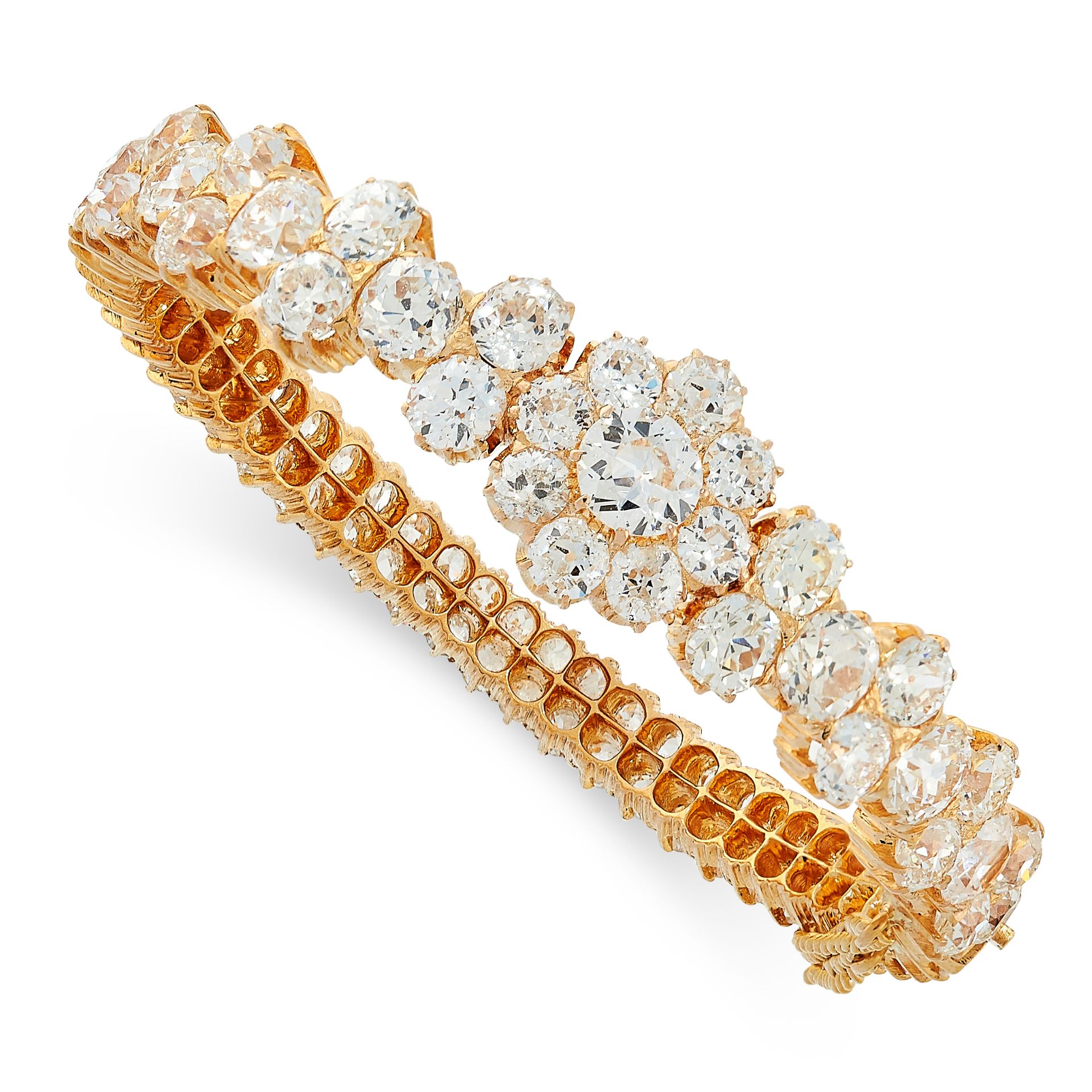 FINE DIAMOND BANGLE in yellow gold, set all around with clusters and rows of old cut diamonds, the