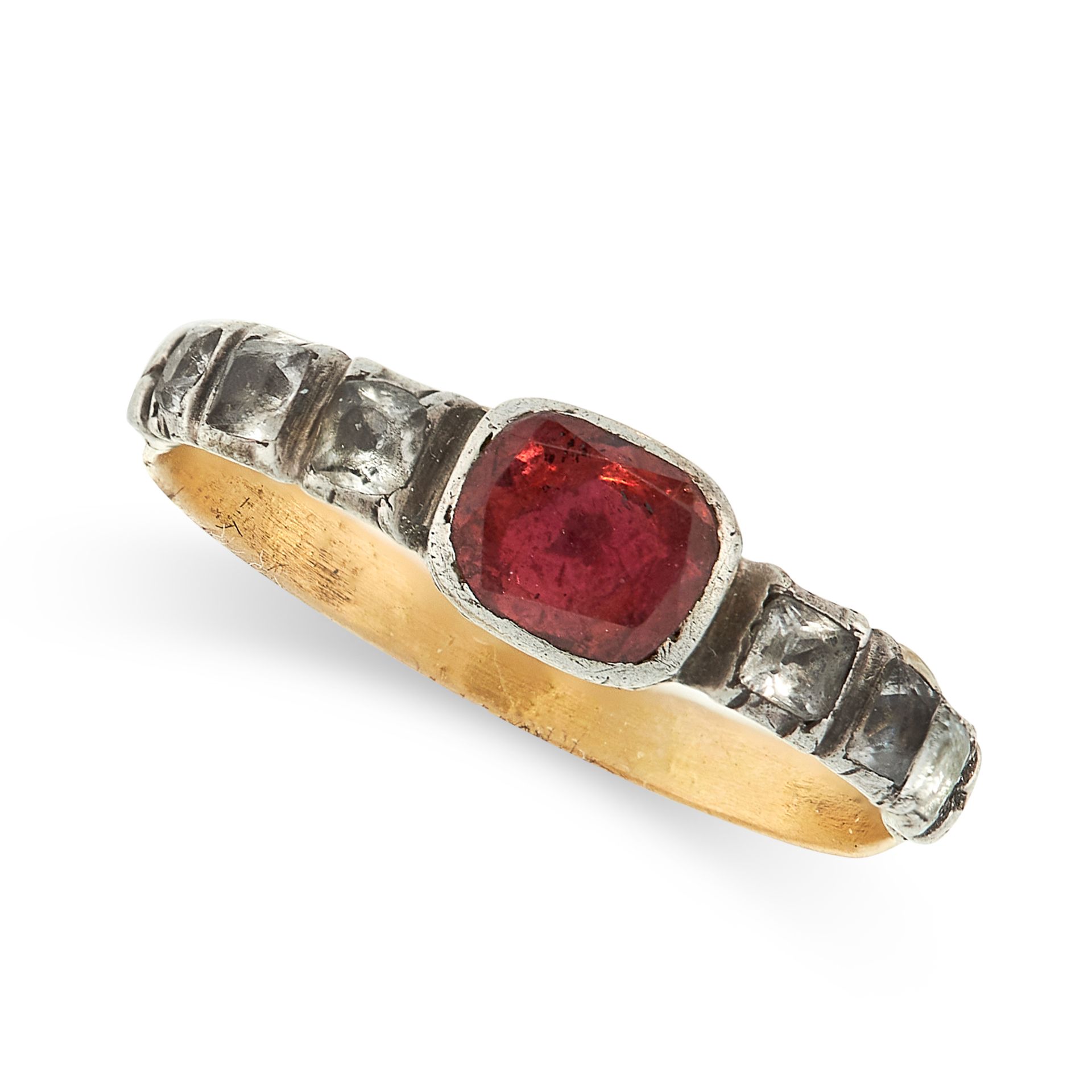 ANTIQUE GARNET AND PASTE RING in yellow gold and silver, set with a cushion cut garnet, between