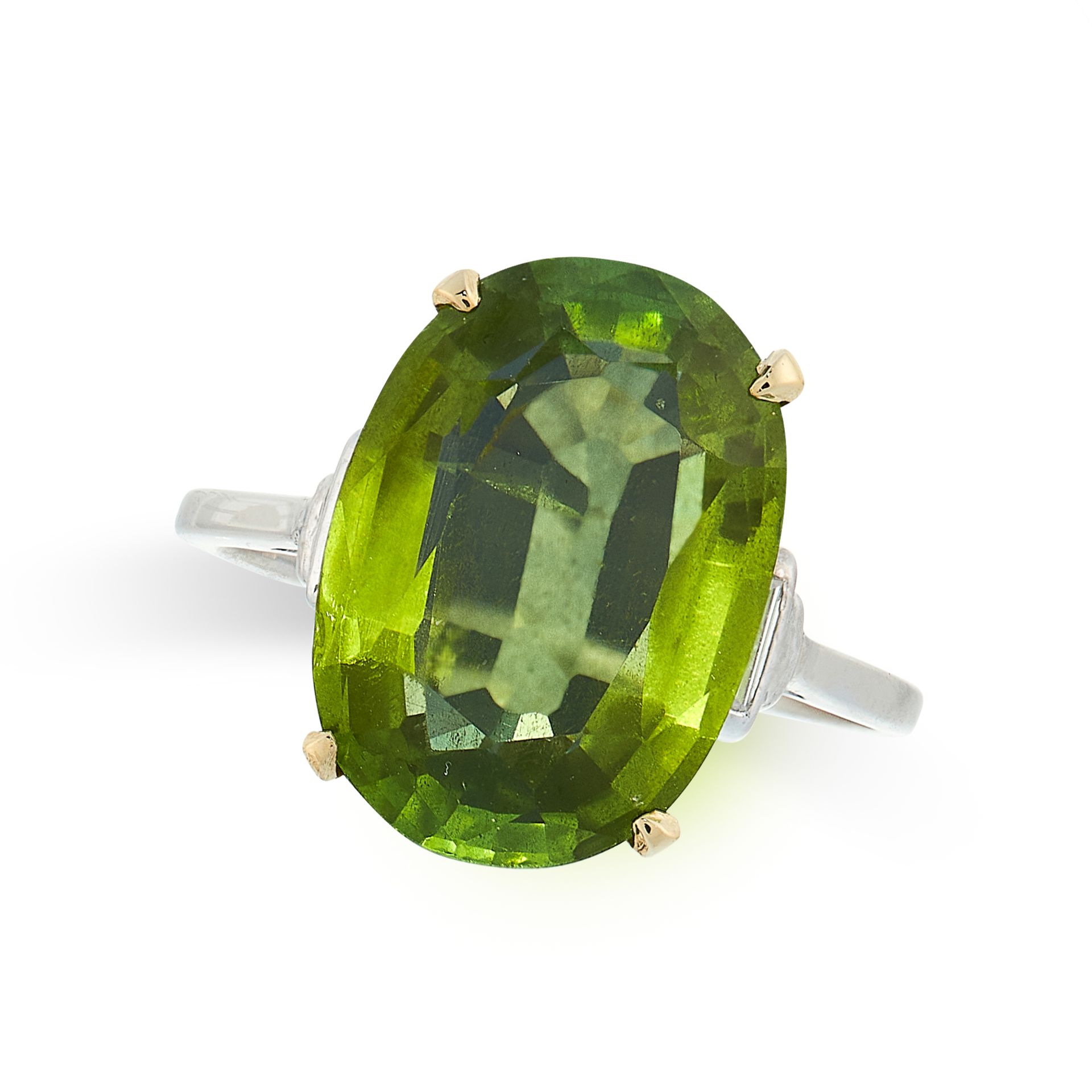 PERIDOT AND DIAMOND RING in platinum and 18ct yellow gold, set with an oval cut peridot of 7.98