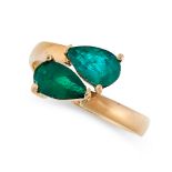 EMERALD TOI ET MOI RING the twisted band set with two pear cut emeralds of 0.71 and 0.67 carats,