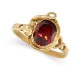 ANTIQUE GEMSET SNAKE RING in yellow gold, set with an oval cut red paste gemstone, bordered by a