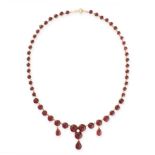 ANTIQUE GARNET AND PEARL NECKLACE in 15ct yellow gold, comprising a single row of graduated round