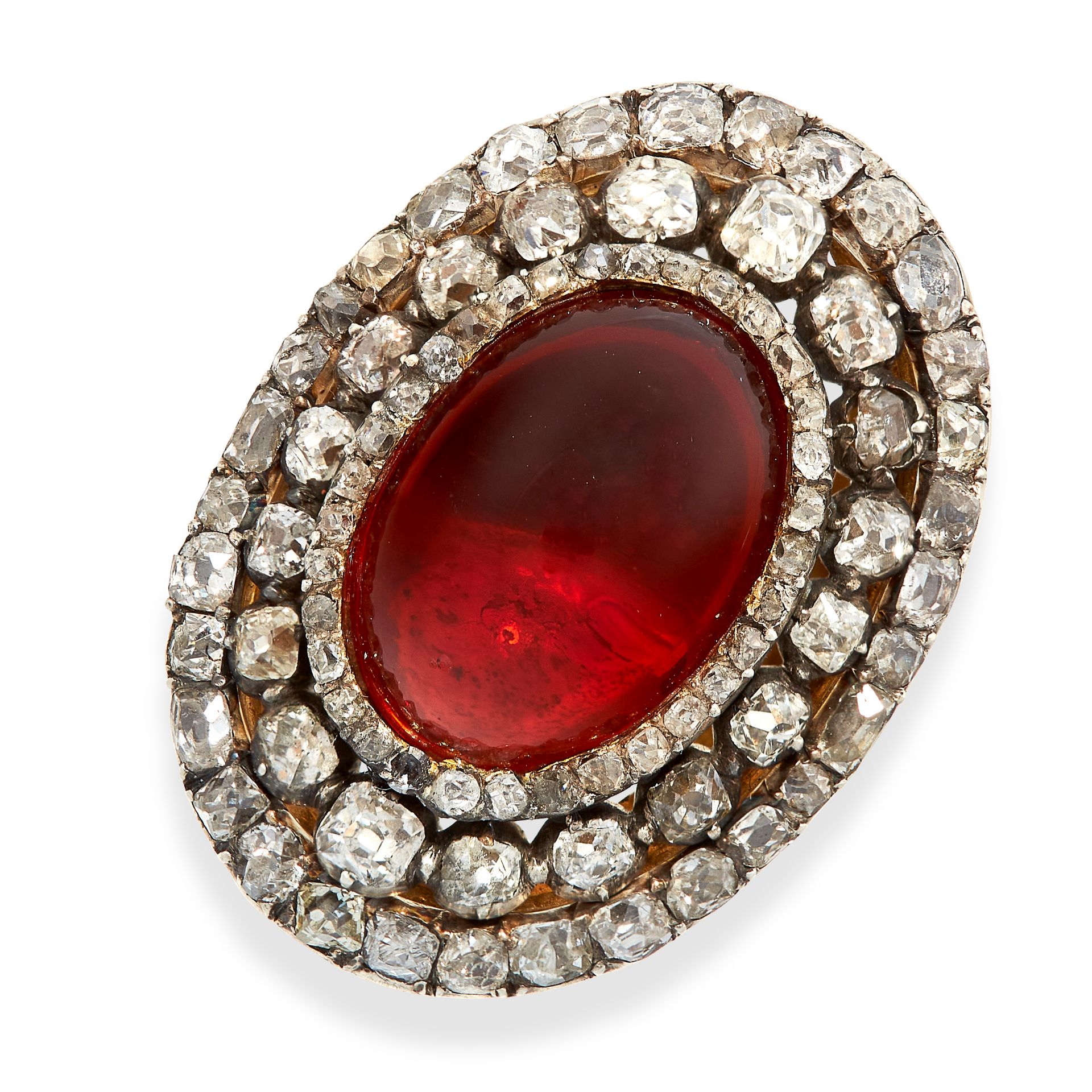 AN ANTIQUE GARNET AND DIAMOND RING in yellow gold and silver, set with an oval cabochon garnet