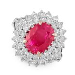 A BURMA NO HEAT RUBY AND DIAMOND RING in 18ct white gold, set with a central cushion cut ruby of 3.