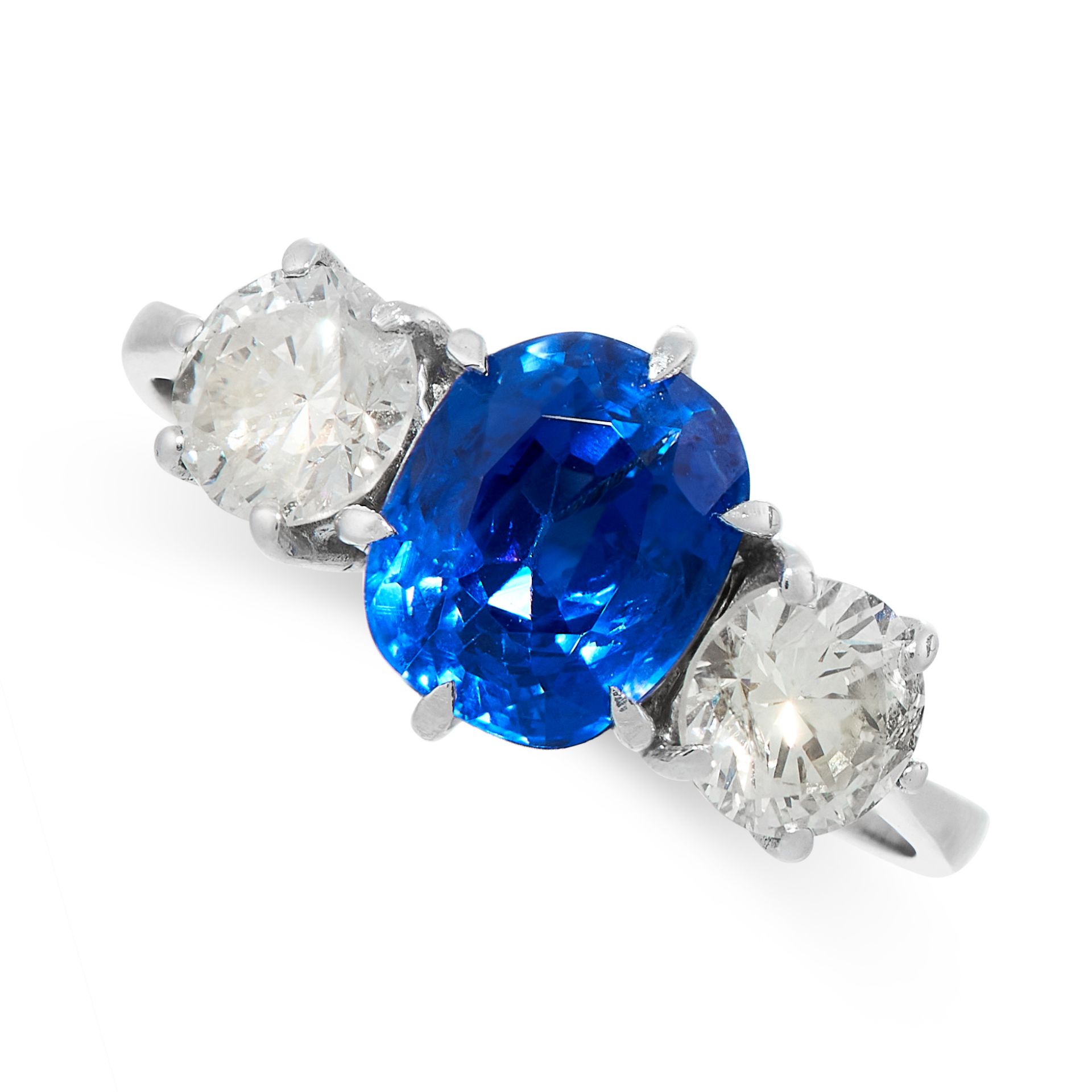 A CEYLON NO HEAT SAPPHIRE AND DIAMOND RING set with a central cushion cut blue sapphires of 2.30