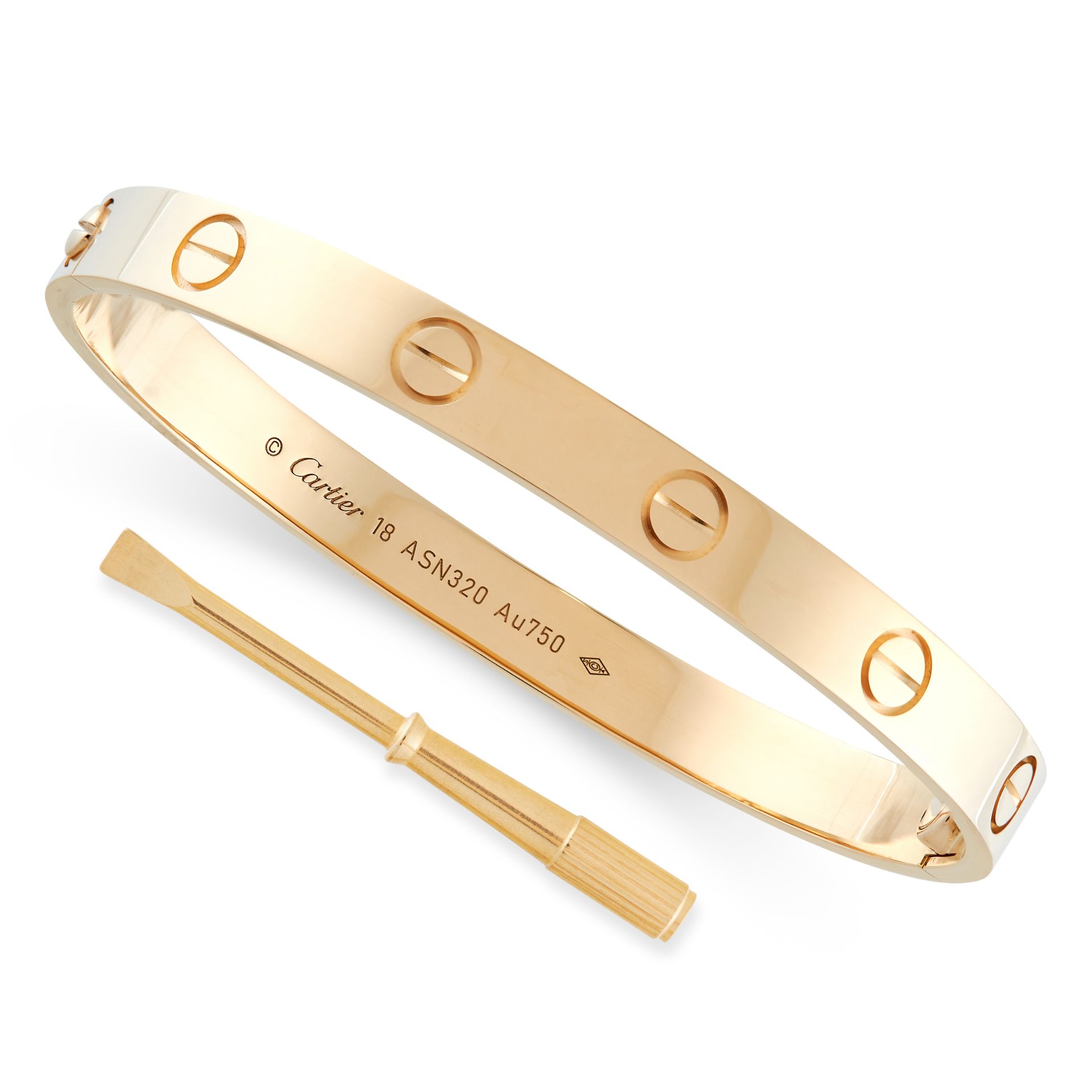 A LOVE BANGLE, CARTIER in 18ct yellow gold, the two-part bangle with screw head motifs, opening