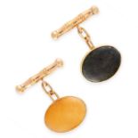 PAIR OF YELLOW JADE AND NEPHRITE HARDSTONE CUFFLINKS each collet set with an oval cabochon, one of