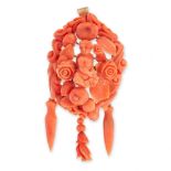 ANTIQUE CORAL BROOCH / PENDANT, CIRCA 1875 in yellow gold, the frame set allover with carved coral