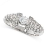 DIAMOND DRESS RING in platinum, set with a round cut diamond between tapering shoulders, all set