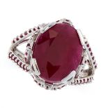 BURMA NO HEAT RUBY RING set with an oval cut ruby of 8.90 carats on an open framework set with