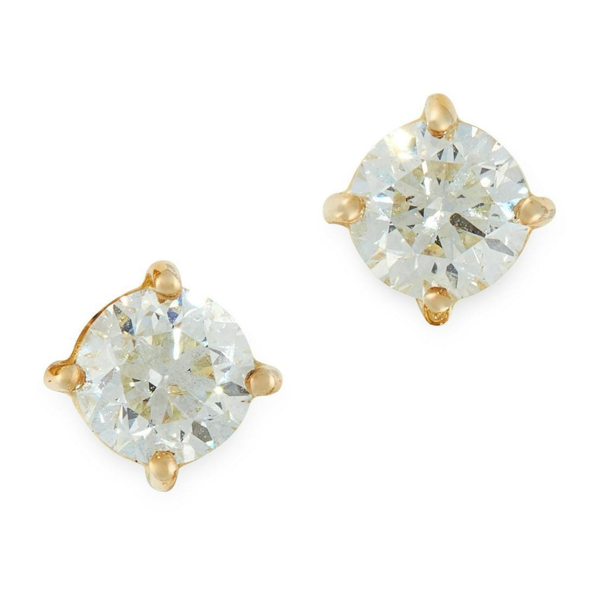 PAIR OF DIAMOND STUD EARRINGS each set with a round cut diamond, both totalling 1.01 carats, stamped