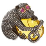 CITRINE, RUBY AND DIAMOND BROOCH designed as a monkey clutching a large faceted citrine, its body