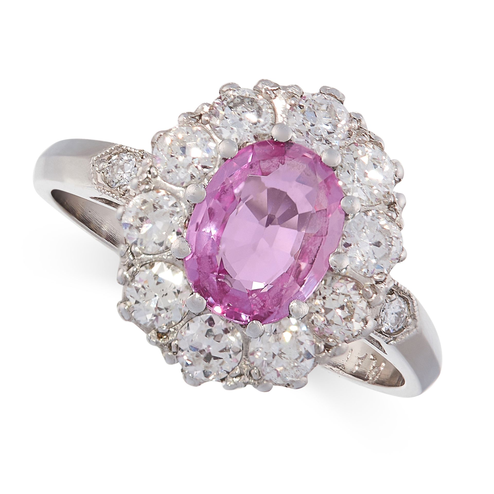 PINK SAPPHIRE AND DIAMOND RING set with an oval cut pink sapphire of 1.40 carats in a cluster of