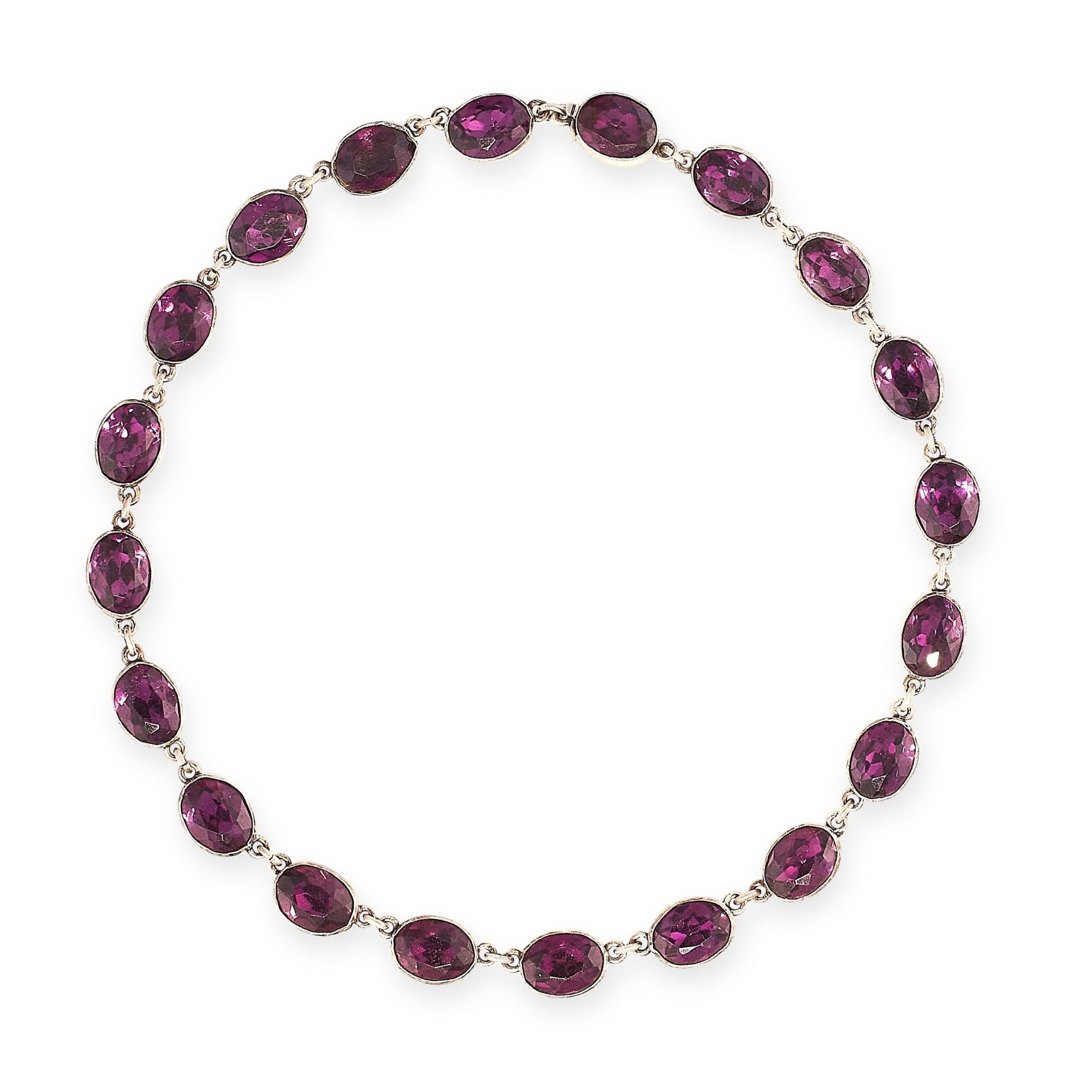 ANTIQUE PASTE AMETHYST RIVIERE NECKLACE in silver, comprising a single row of twenty oval cut purple