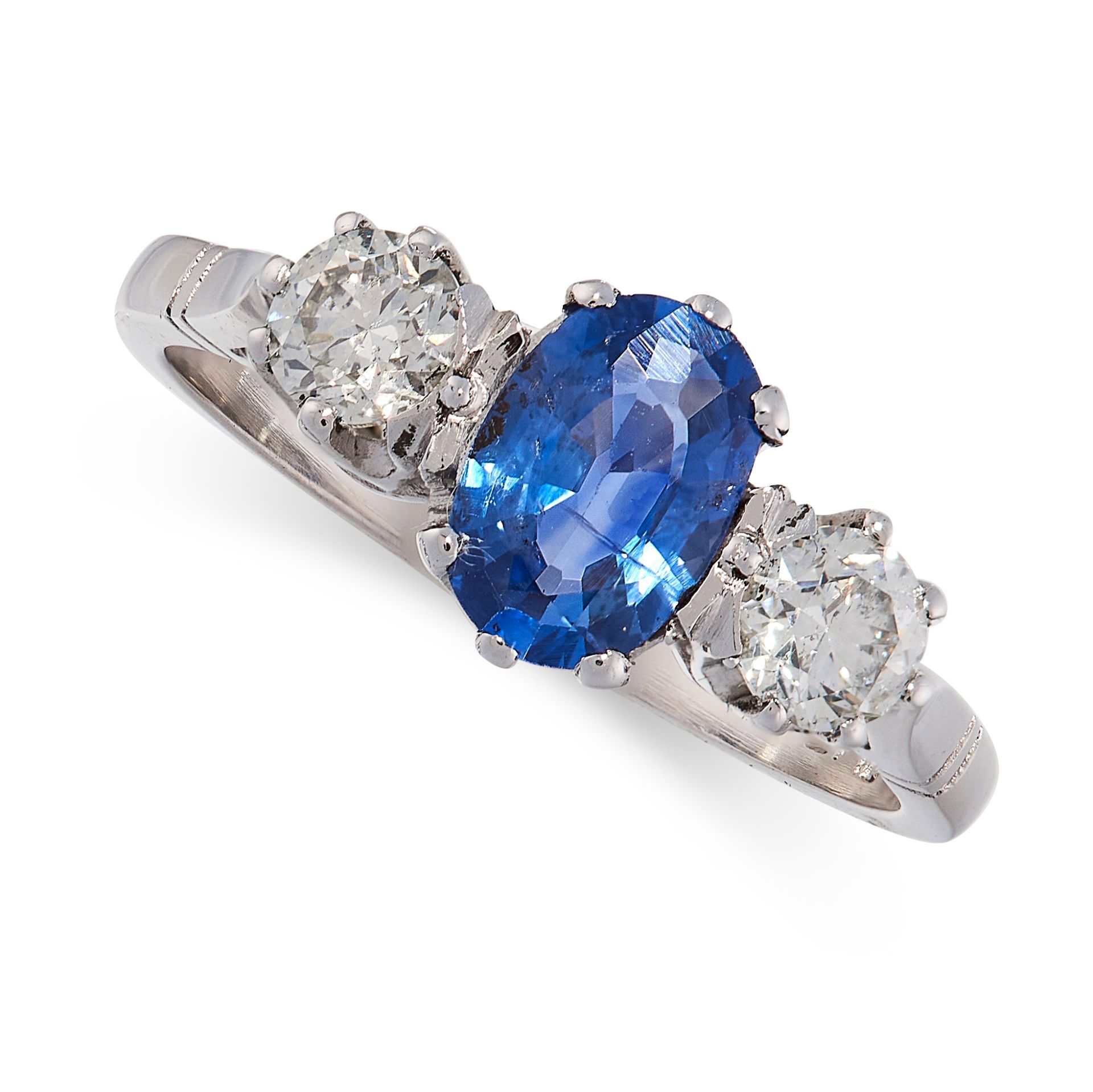SAPPHIRE AND DIAMOND THREE STONE RING in platinum, set with an oval cut sapphire of 1.10 carats