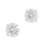A PAIR OF DIAMOND STUD EARRINGS each set with a round cut diamond, both totalling 4.08 carats,