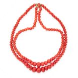 A CORAL BEAD NECKLACE in 18ct yellow gold, comprising two rows of graduated polished coral beads