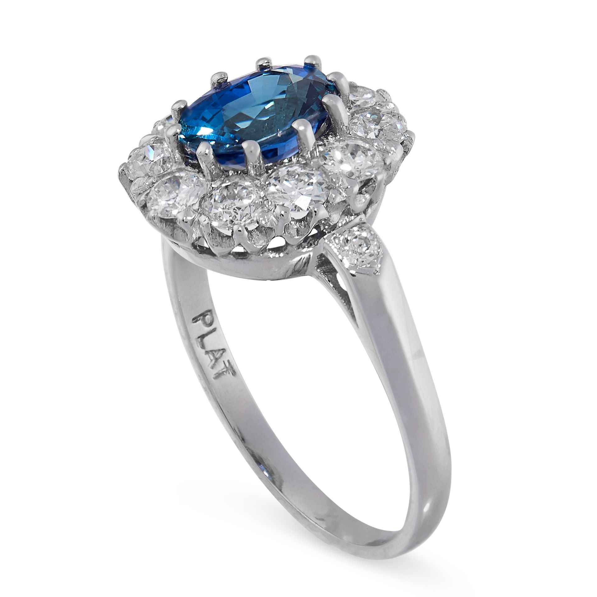 A SAPPHIRE AND DIAMOND CLUSTER RING in platinum, set with a cushion cut blue sapphire of 1.50 - Image 2 of 2