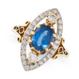 A SAPPHIRE AND DIAMOND RING in 18ct yellow gold, the navette face set with an oval cut sapphire of