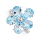 A TOPAZ AND DIAMOND RING in platinum, in the form of a flower, set with pear cut topaz petals and