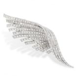 A VINTAGE DIAMOND FEATHER BROOCH in platinum, designed as a coiled feather, jewelled throughout with