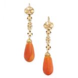 A PAIR OF ANTIQUE AMBER EARRINGS in yellow gold, comprising of a polished amber drop below a