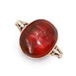 AN ANTIQUE CARNELIAN CAMEO RING in yellow gold, set with an oval carnelian cameo carved to depict