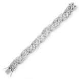 A VINTAGE DIAMOND BRACELET formed of a series of articulated links set throughout with round cut,