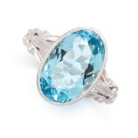 AN AQUAMARINE RING set with an oval cut aquamarine of 5.60 carats with scrolls to the shoulders,