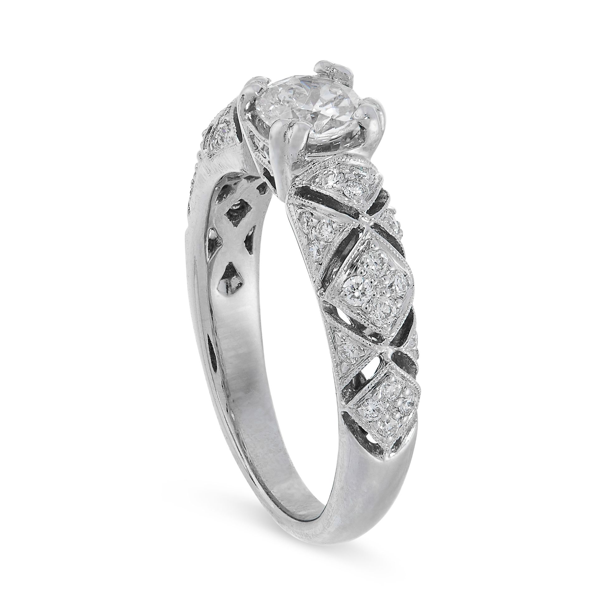 A DIAMOND RING in 18ct white gold, set with a central round cut diamond of 0.51 carats on a tapering - Image 2 of 2