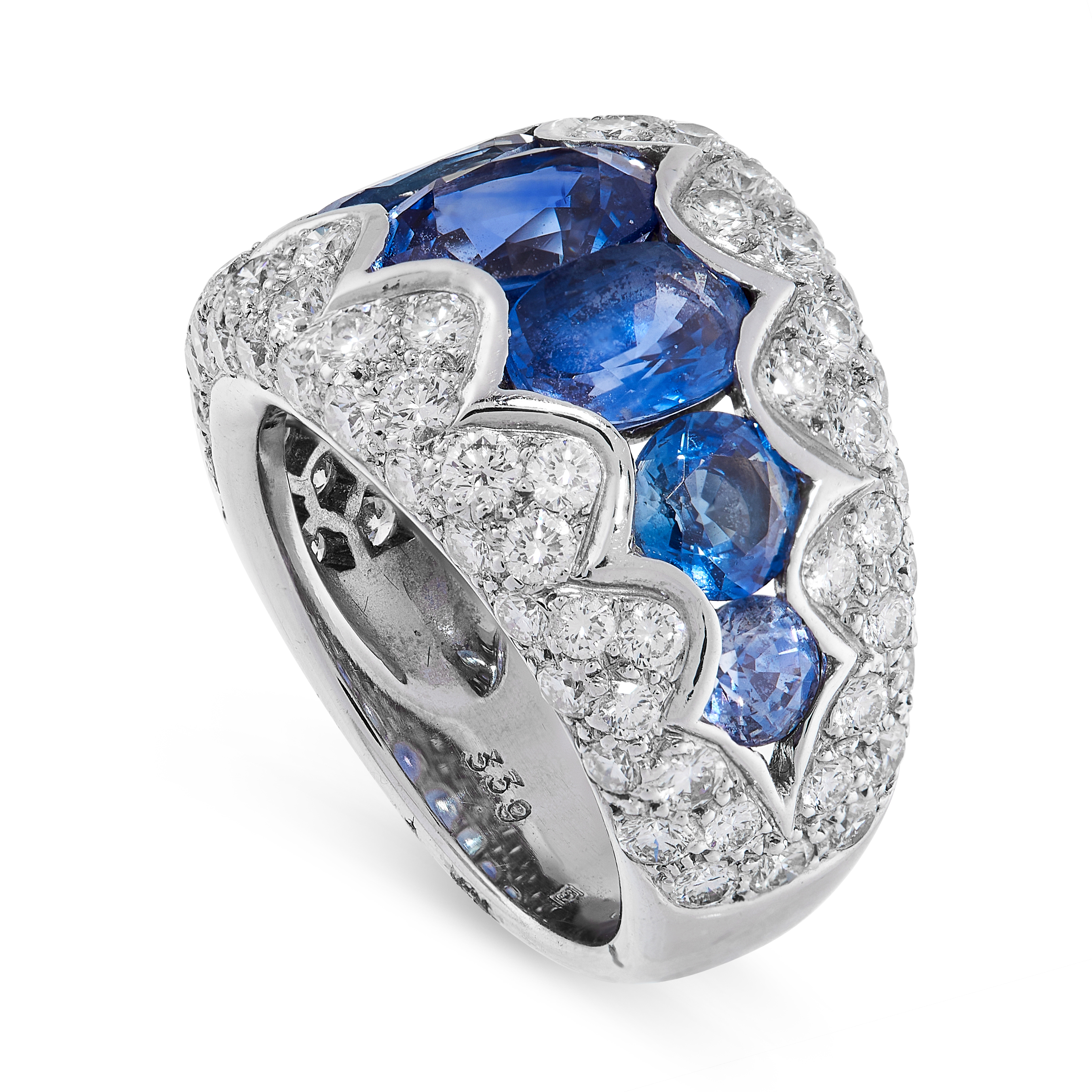 A SAPPHIRE AND DIAMOND RING in 18ct white gold, set with a row of graduated oval cut sapphires, - Image 2 of 2