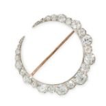 A DIAMOND CRESCENT MOON BROOCH designed as a tapering crescent moon, set with a row of graduated old