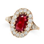 A SPINEL AND DIAMOND RING in 18ct yellow gold, claw set with a central oval cut red spinel of 2.22