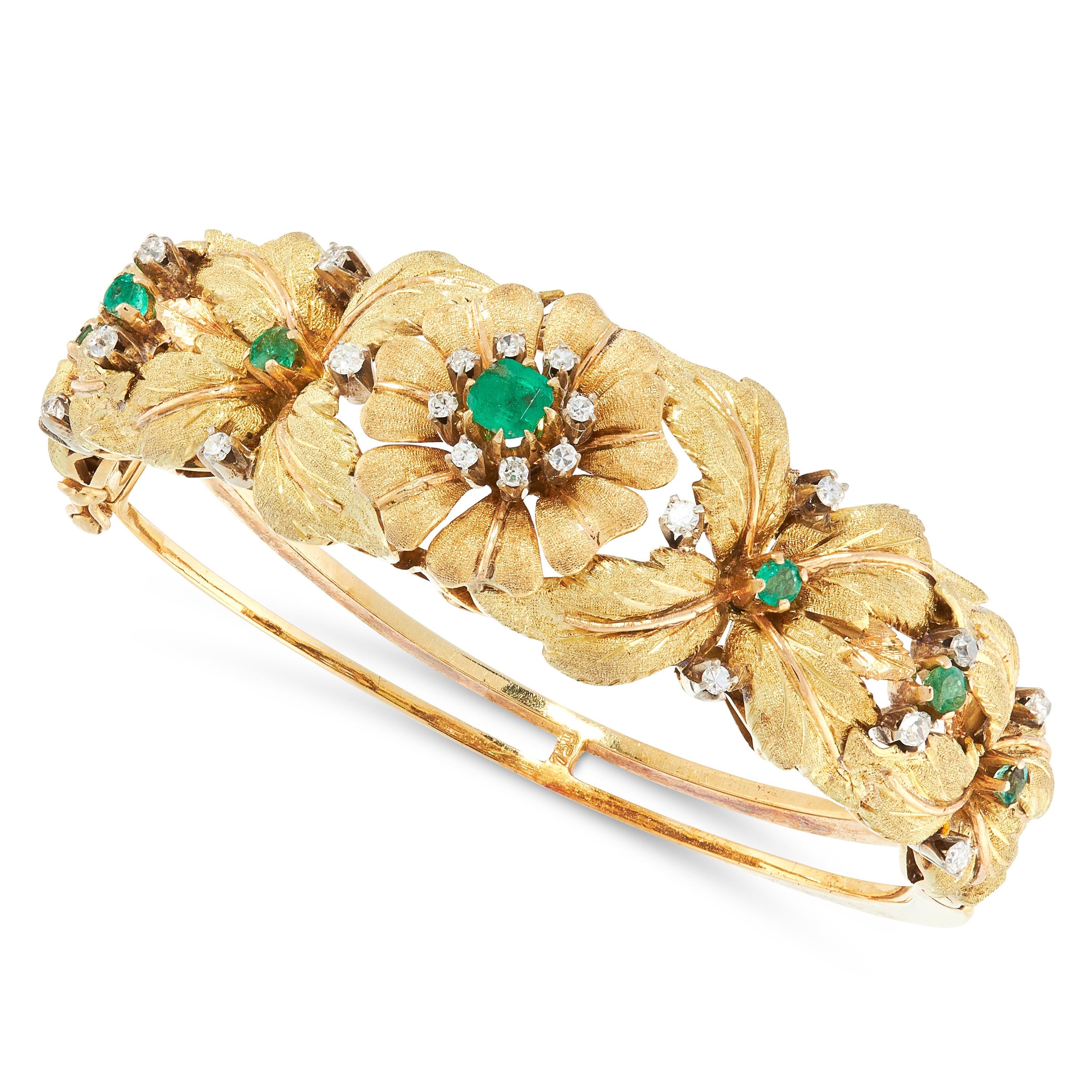 A VINTAGE EMERALD AND DIAMOND BANGLE, CIRCA 1950 in 18ct yellow gold, the tapering body with applied