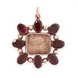 AN ANTIQUE GARNET AND HAIRWORK MOURNING LOCKET BROOCH / PENDANT, 19TH CENTURY in yellow gold, the