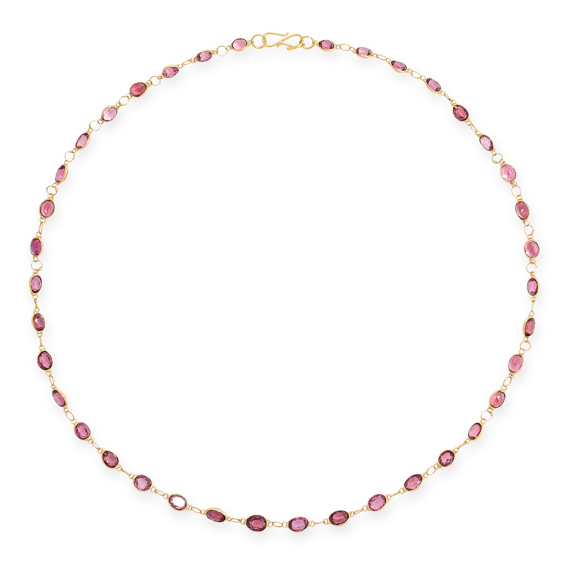 A GARNET CHAIN NECKLACE in yellow gold, comprising a single row of oval cut garnets, no assay marks,