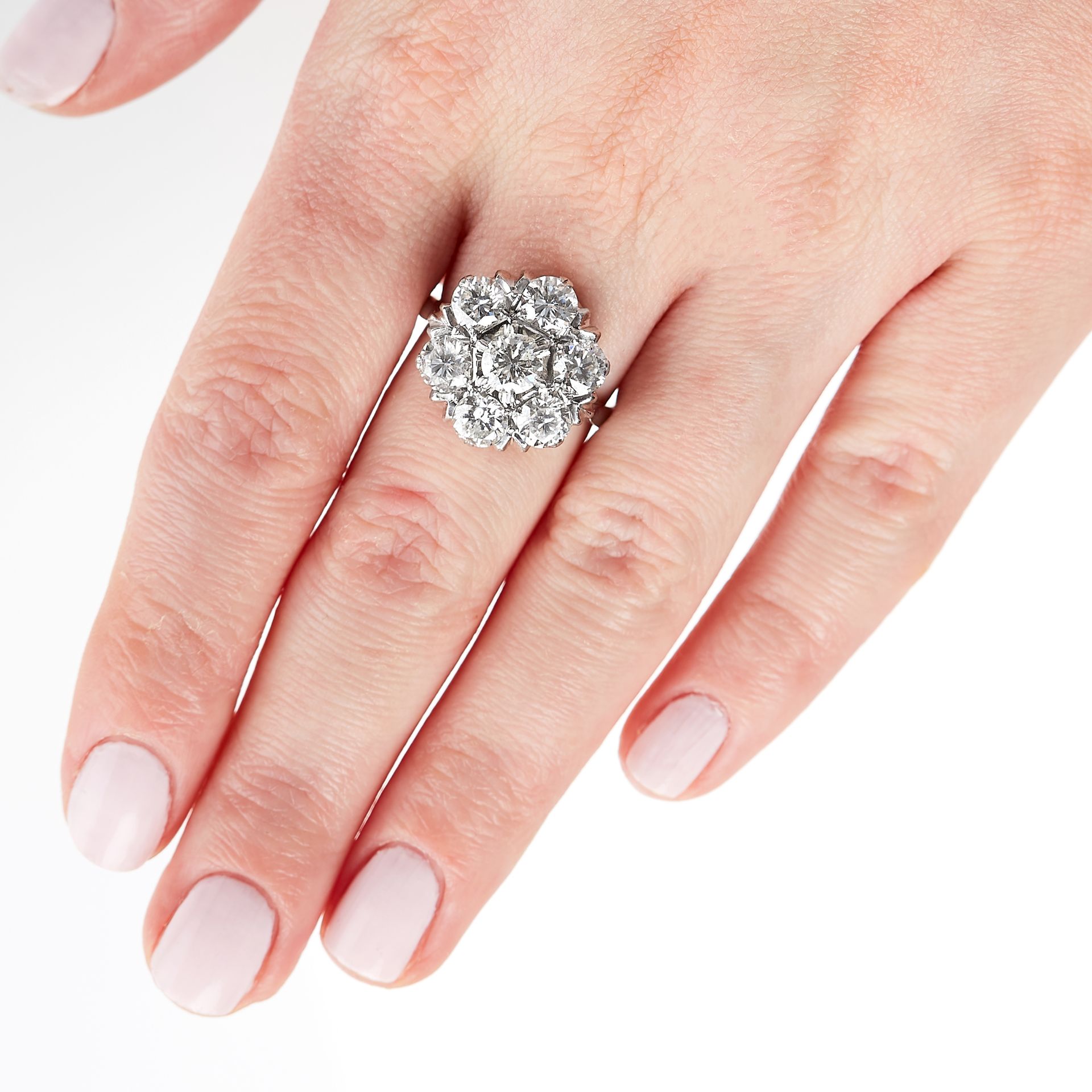 A DIAMOND CLUSTER DRESS RING in 18ct white gold, set with seven round cut diamonds, the diamonds all - Image 3 of 3