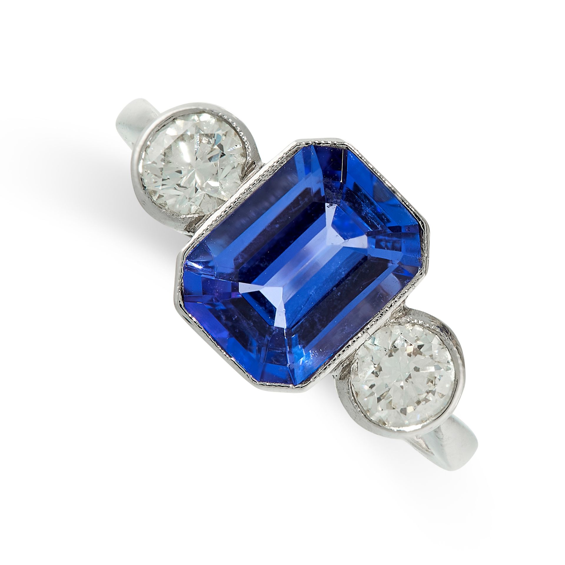 A TANZANITE AND DIAMOND RING in platinum, set with an emerald cut tanzanite of 2.25 carats,
