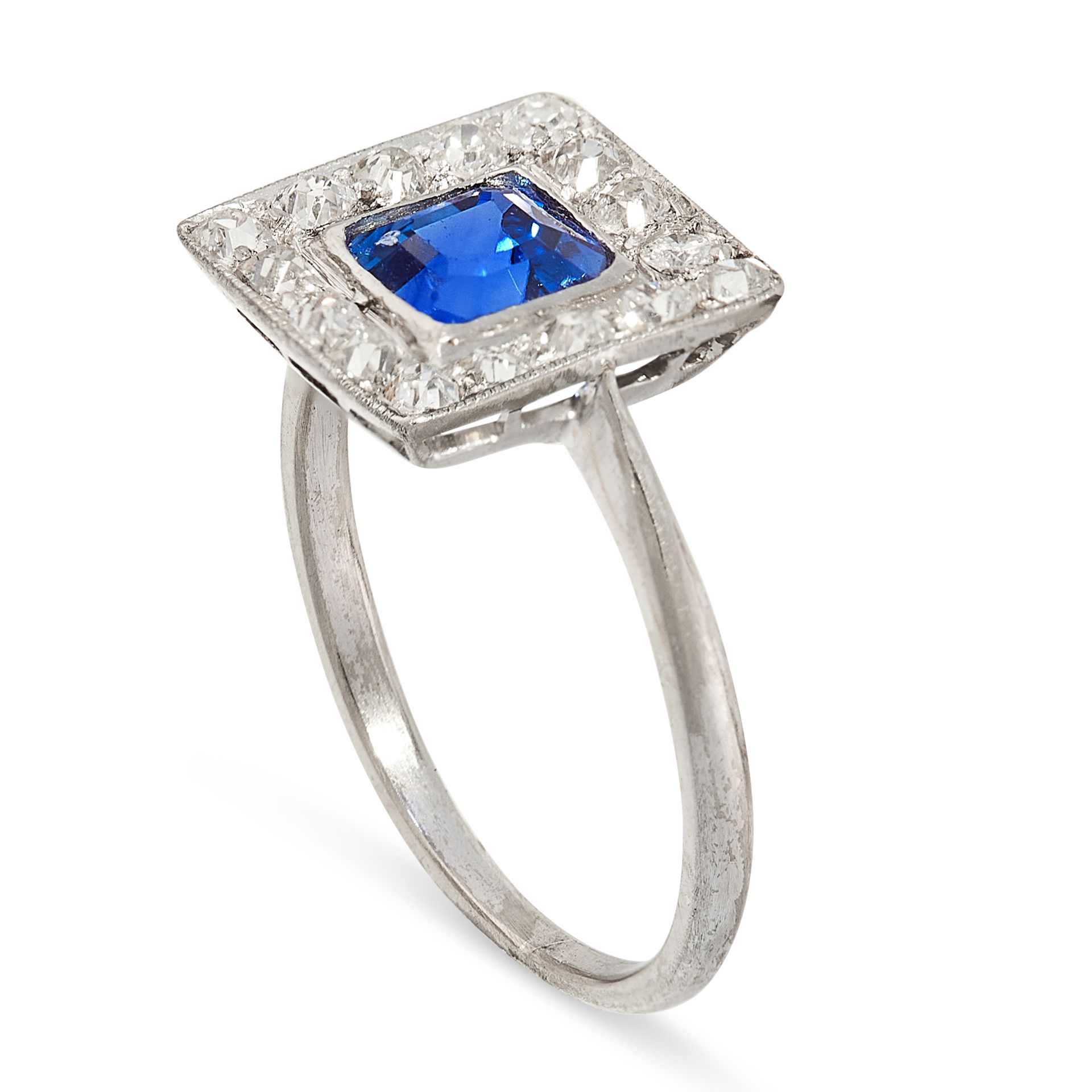 A SAPPHIRE AND DIAMOND RING the square face set with an emerald cut sapphire of 1.11 carats in a - Image 2 of 2