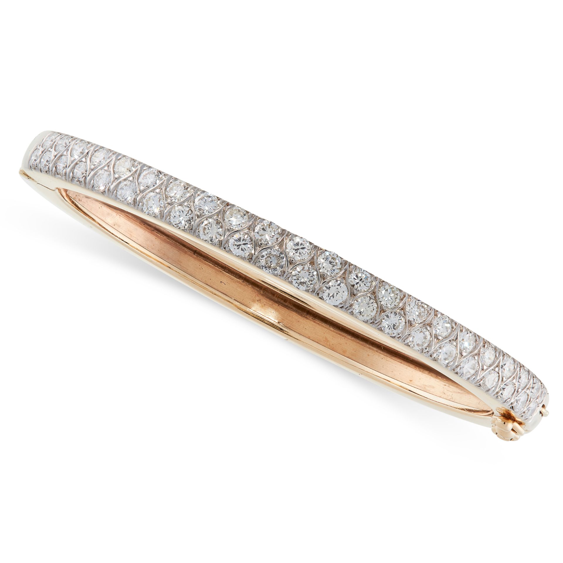 A DIAMOND BANGLE in yellow gold, the hinged body set to one half with two rows of round cut