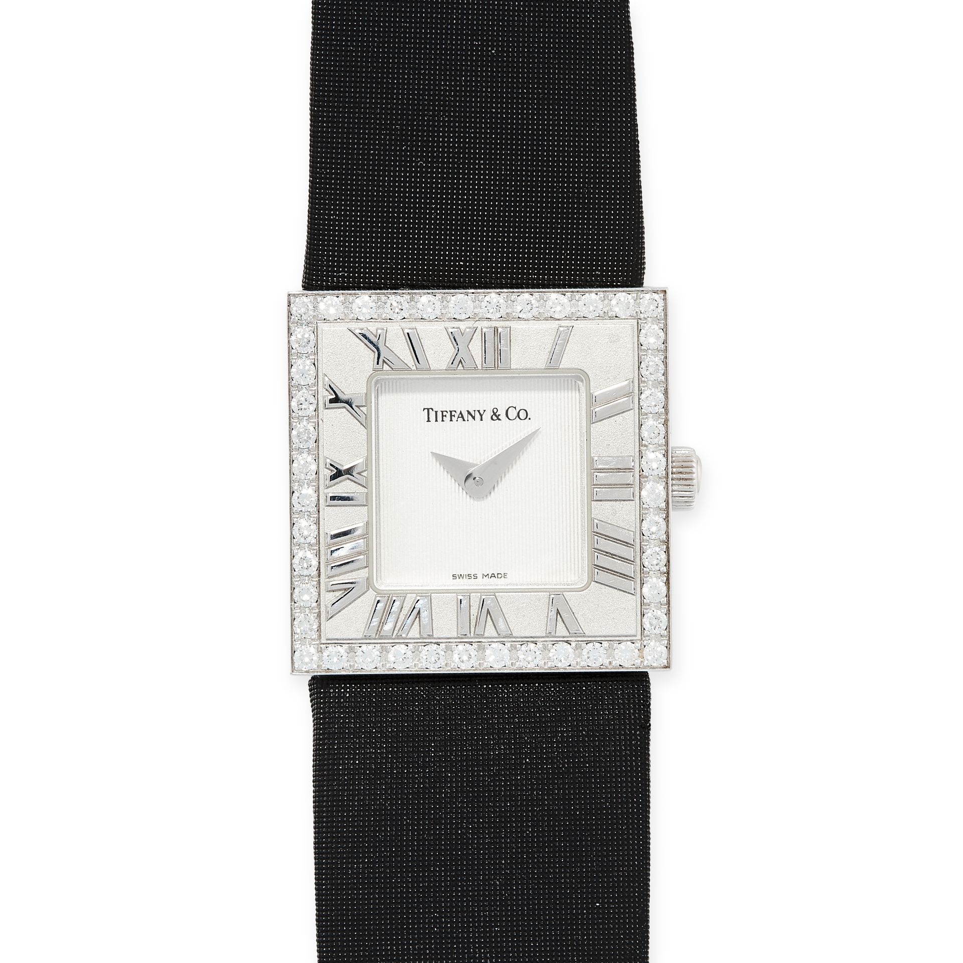 A DIAMOND ATLAS WRIST WATCH, TIFFANY & CO in 18ct white gold, the square face is set with a white